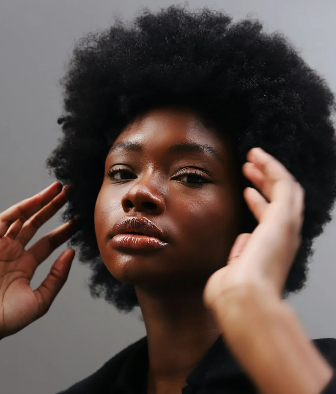 Close-up portrait of a woman with glowing skin